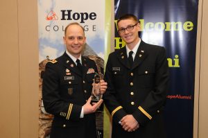 Jeremy Latchaw '00 after receiving a 2015 Hope College Young Alumni Award. Jeb Wierenga, a Hope ROTC student, presented the award. 