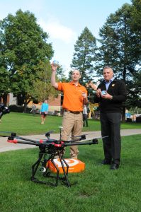 Jeremy Latchaw '00 and OrangeLeaf President Geoff Goodman celebrate a successful landing.