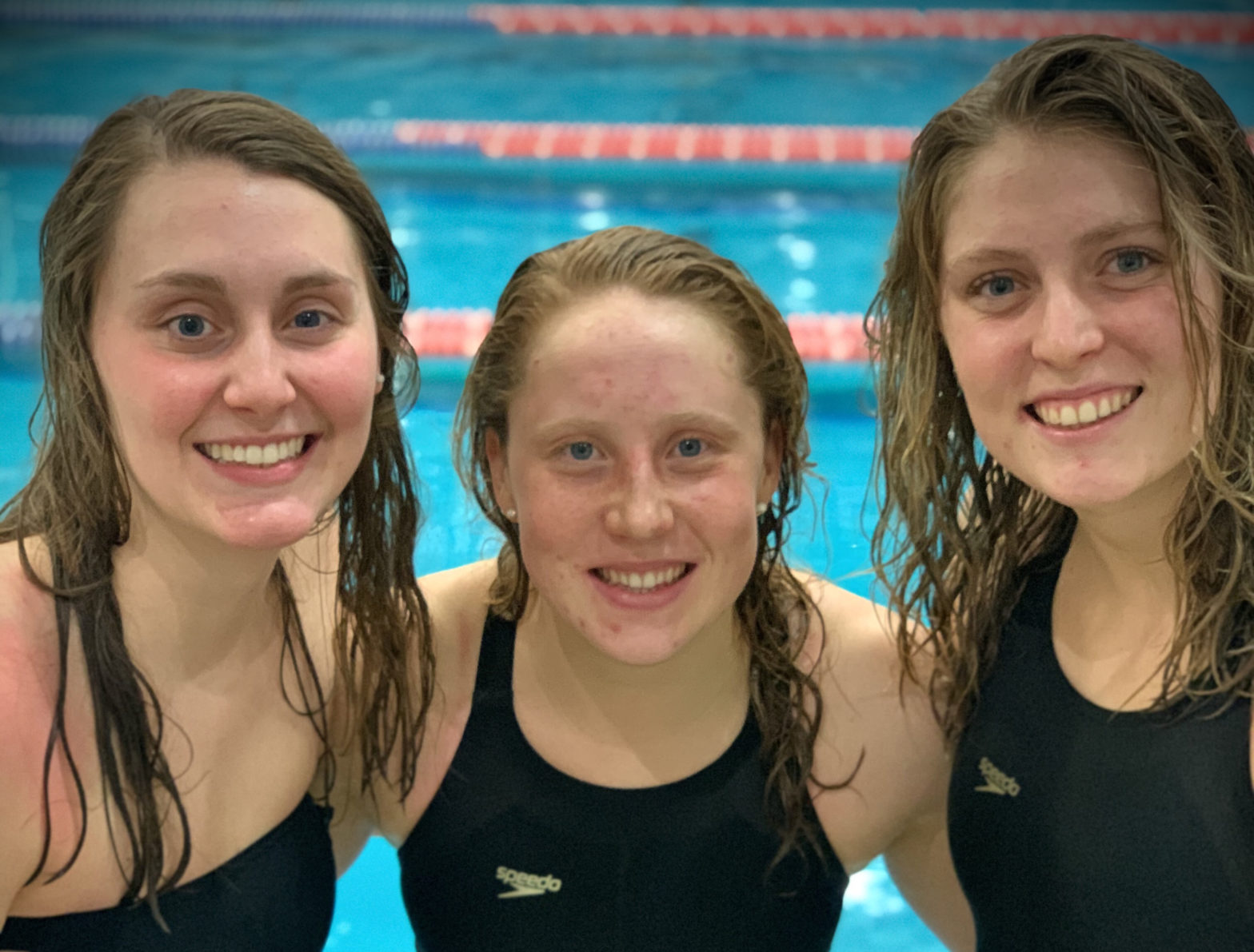 Hope Reynolds, right, poses for a poolside photo with Emma Schaefer, center, and Mackenzie Ralston.