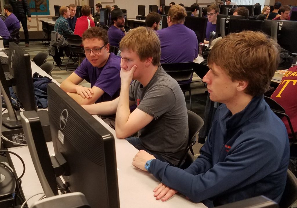 Students Nathan Vance, John Dood, and Roger Veldman participating in the 2016 ACM Programming Competition