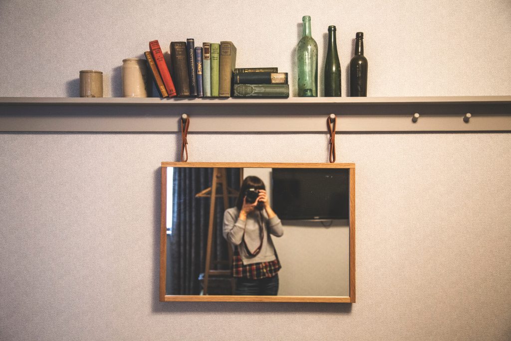 Photographer pictured in a mirror