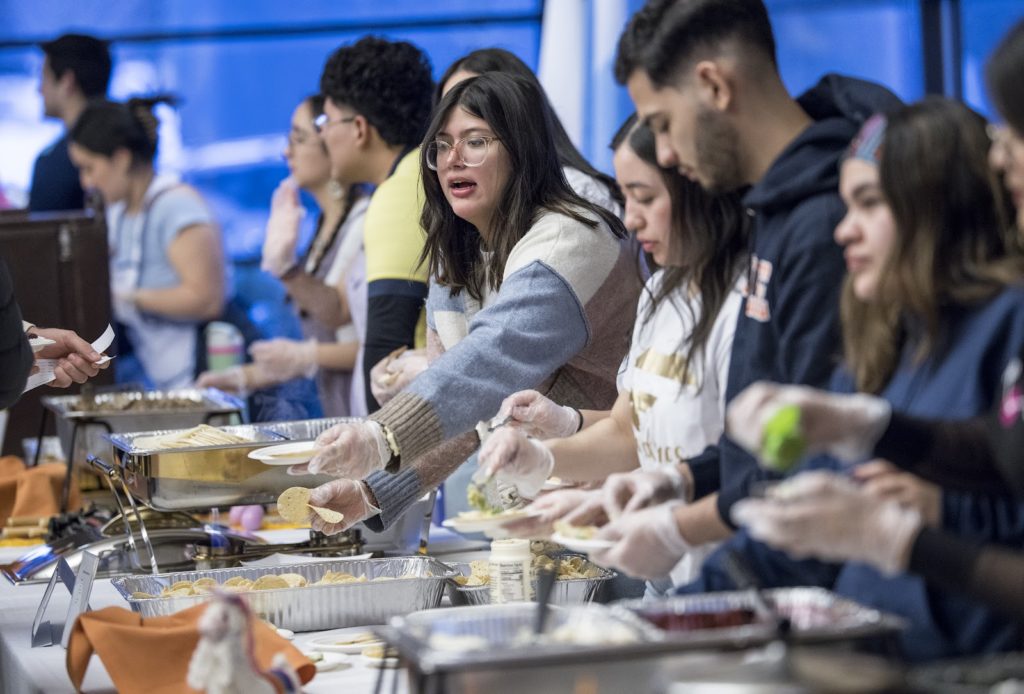 Honduran students serving baleadas
