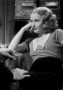 Gif from Baby Face showing Stanwyck pouring coffee on a man's hand