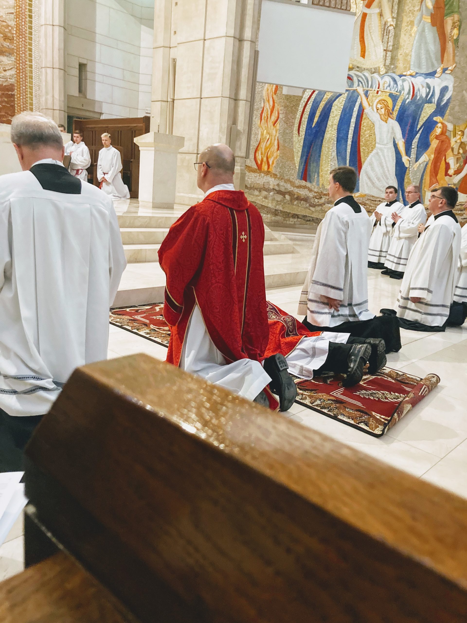 Cardinal Dziwsz prostrate on Good Friday