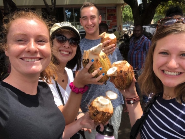 Trying fresh coconut at the market!