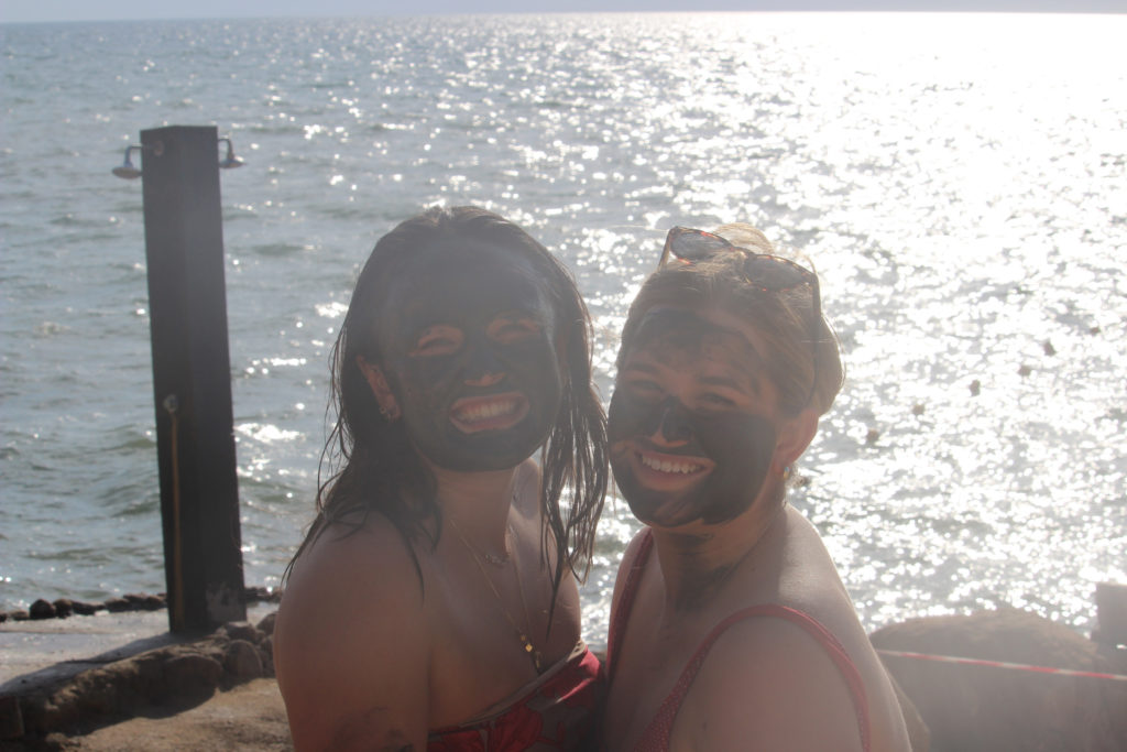 My friend, Devon, and I are covered in Dead Sea mud!