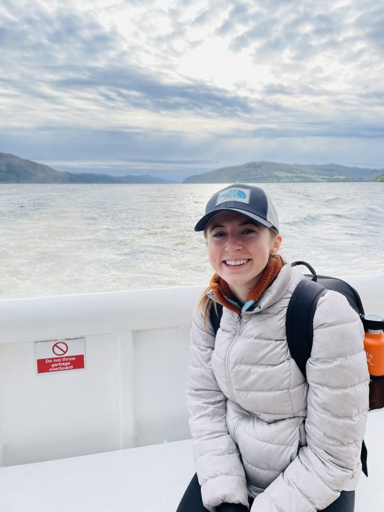 Loch Ness. 
Pictured : a very cold Julia on a Loch Ness tour looking for Nessie! As the well known Loch Ness is home to alleged sightings of the monster itself (Nessie), it's also home to Urquhart Castle. I tried my first Highland hot chocolate on this boat tour as well. 10/10 !