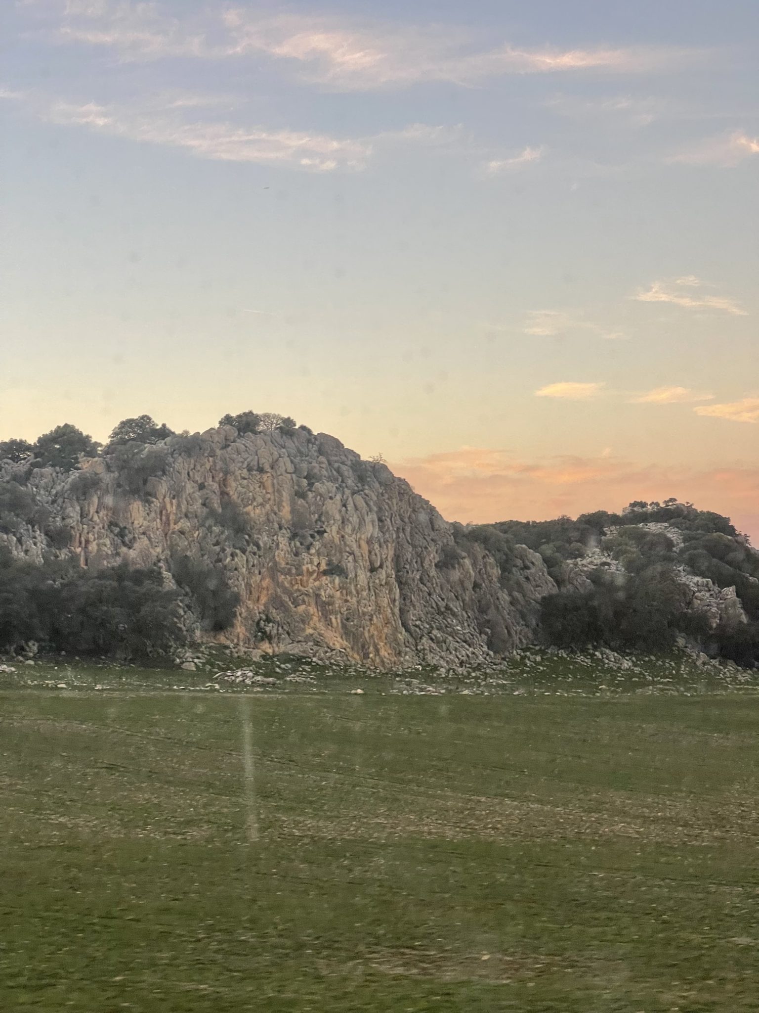 A picture of mountains and a sunset.