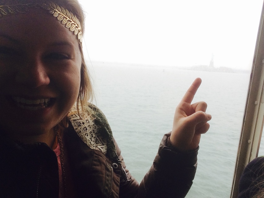 This is her pointing to the Statue of Liberty! She had an amazing time on her last day, as well as the rest of the week. What a great experience!