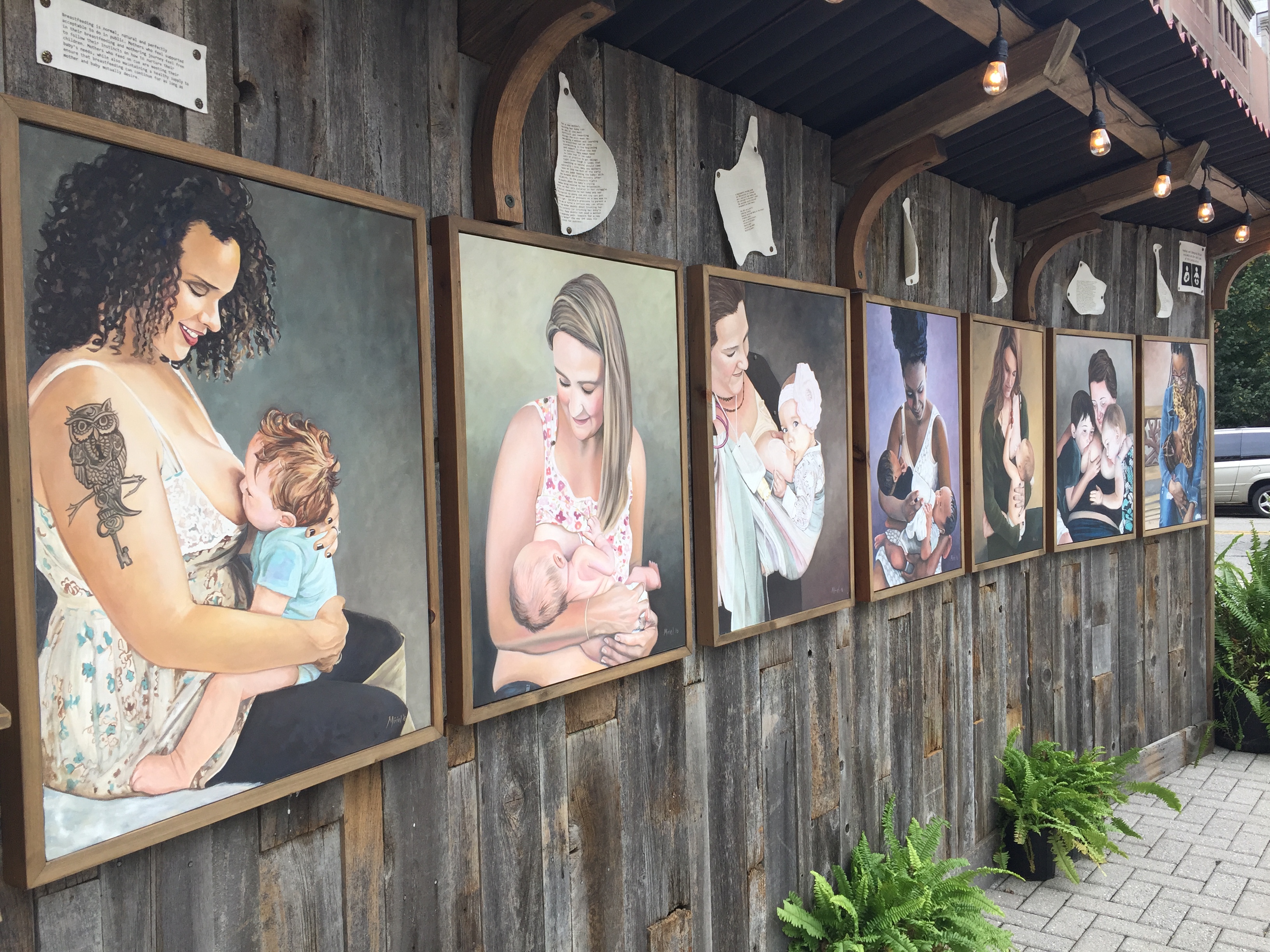 painted portraits of women breastfeeding babies