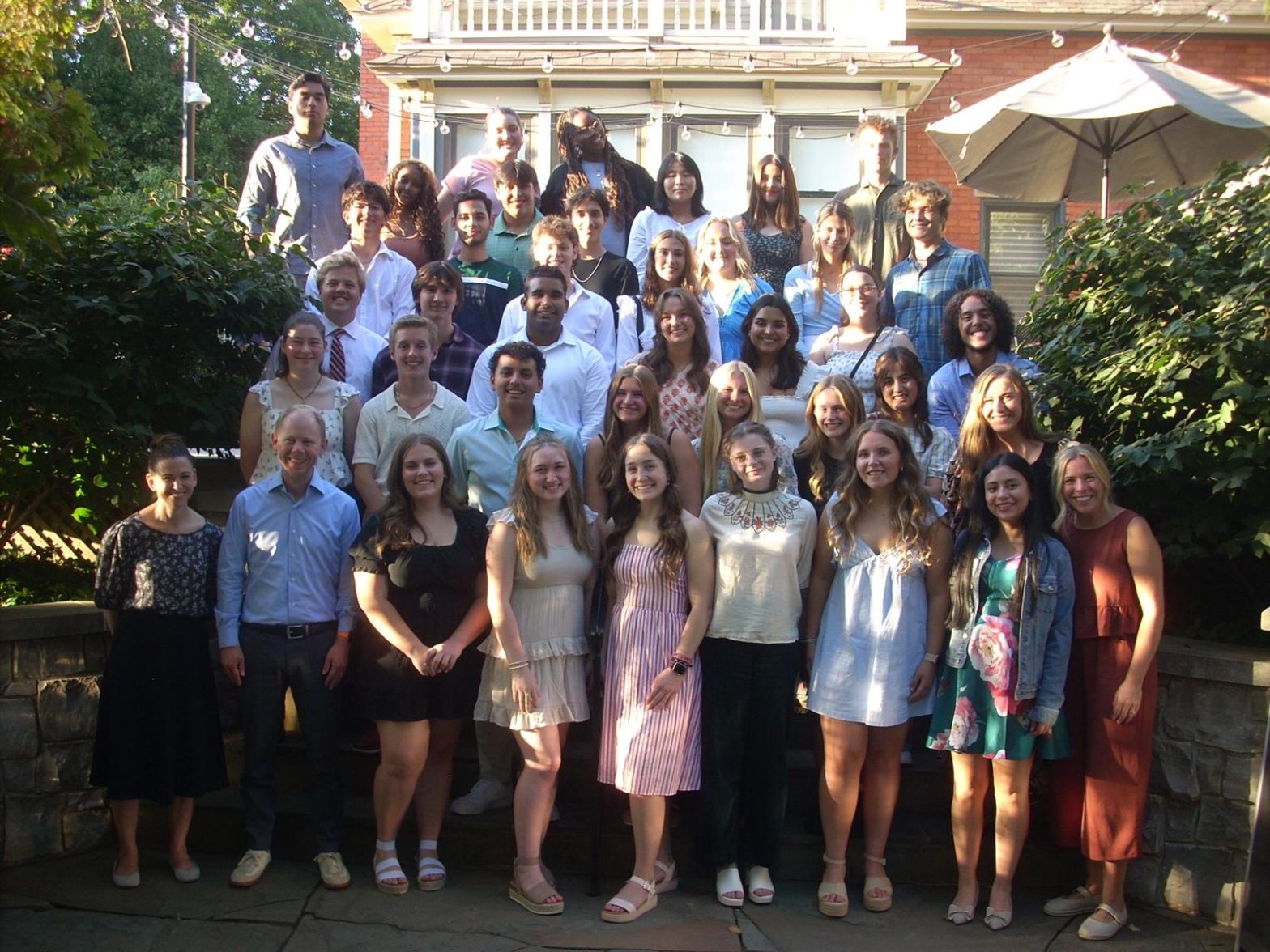 A large group of students in the Hope Forward program post for a group photo